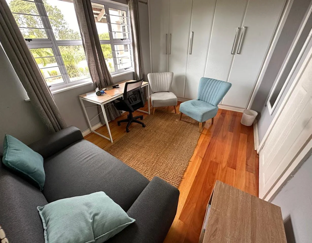 Comfortable counselling consultation room with soft lighting